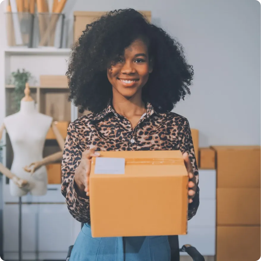 A small business owner preparing a package for delivery